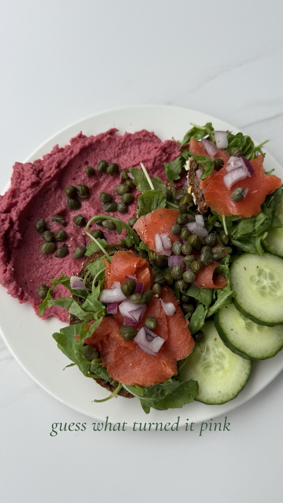 Pink hummus with wild salmon, capers and cucumber